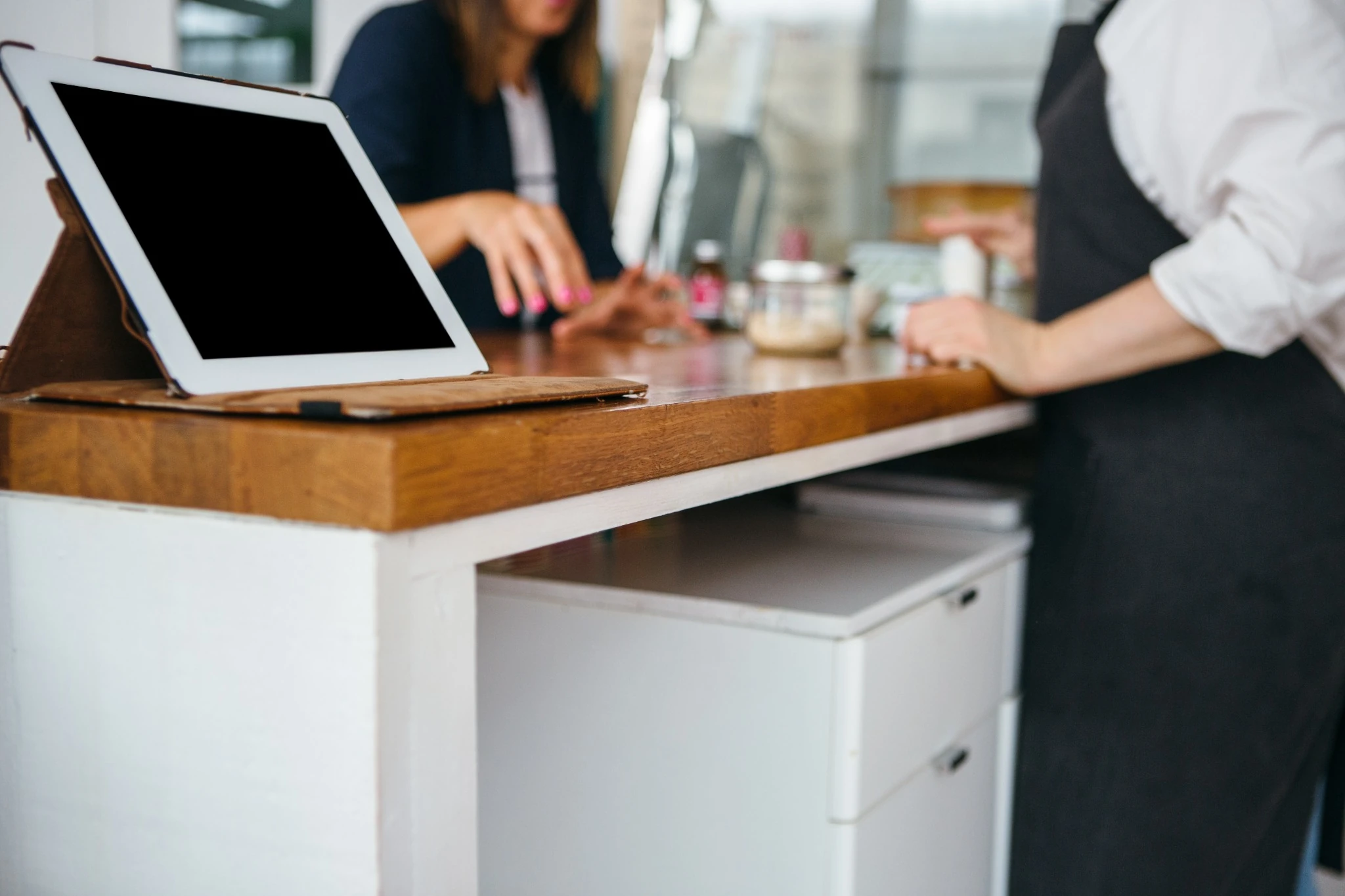 POS tablet and checkout counter setup in a retail business
