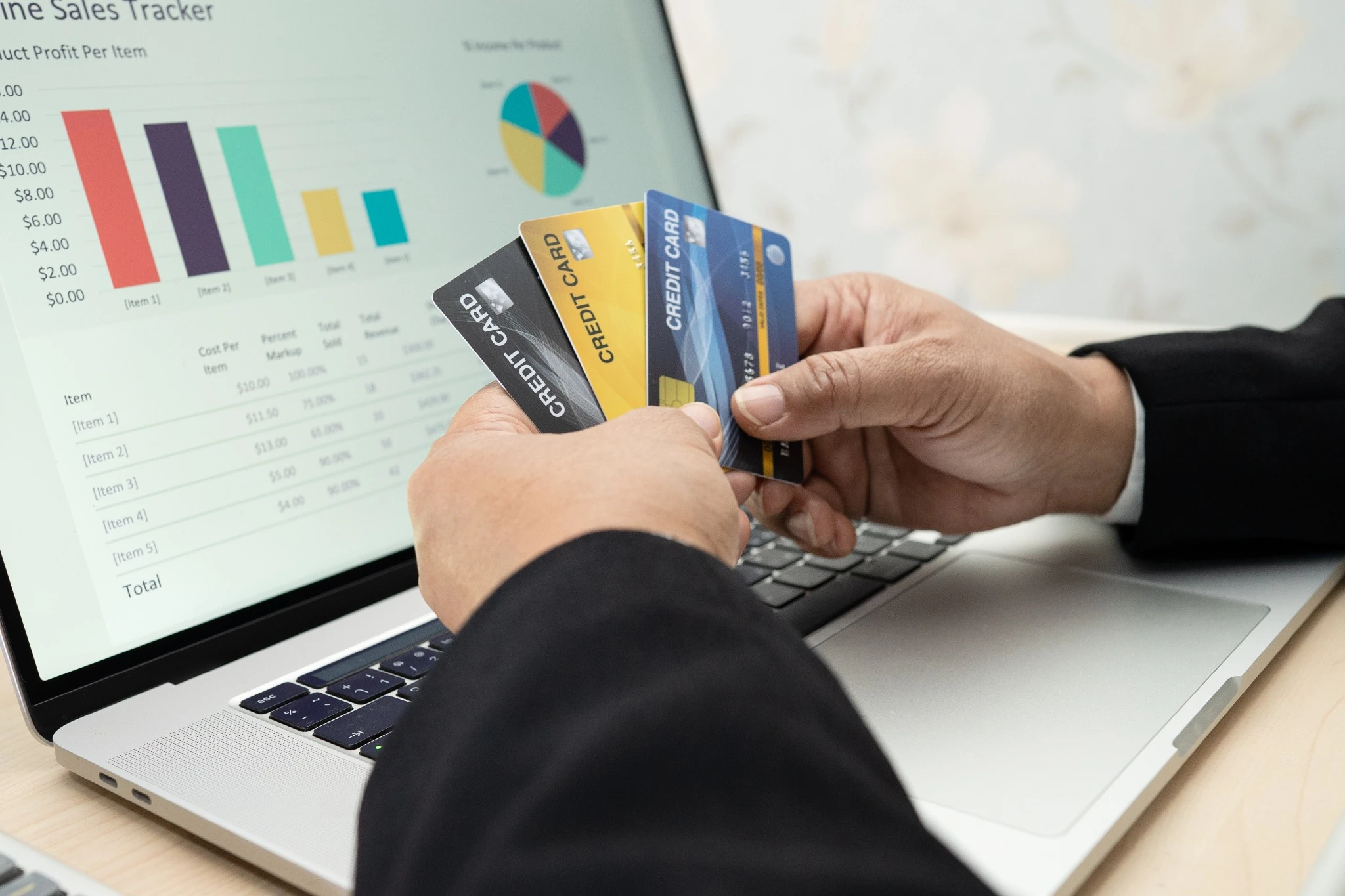 POS software showing sales analytics and payment information on a laptop
