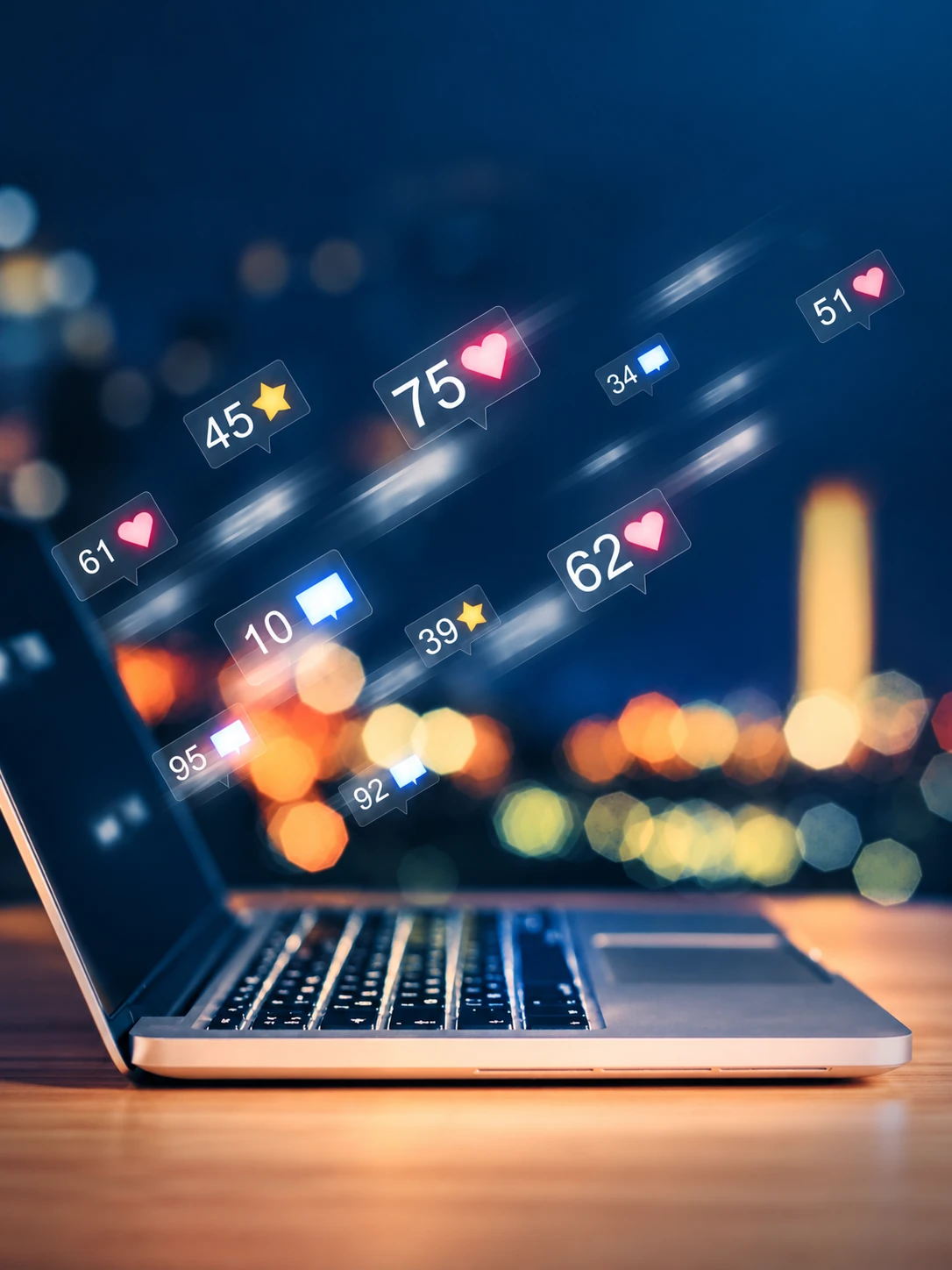 Laptop displaying social media engagement notifications and audience interactions