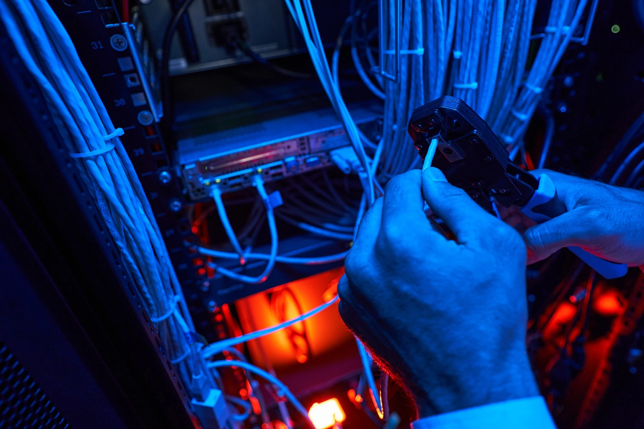 Network technician installing structured cabling in Dubai